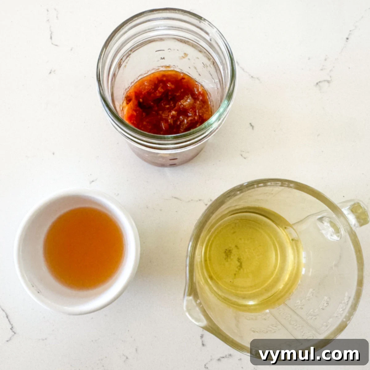 tomato vinaigrette ingredients on marble counter