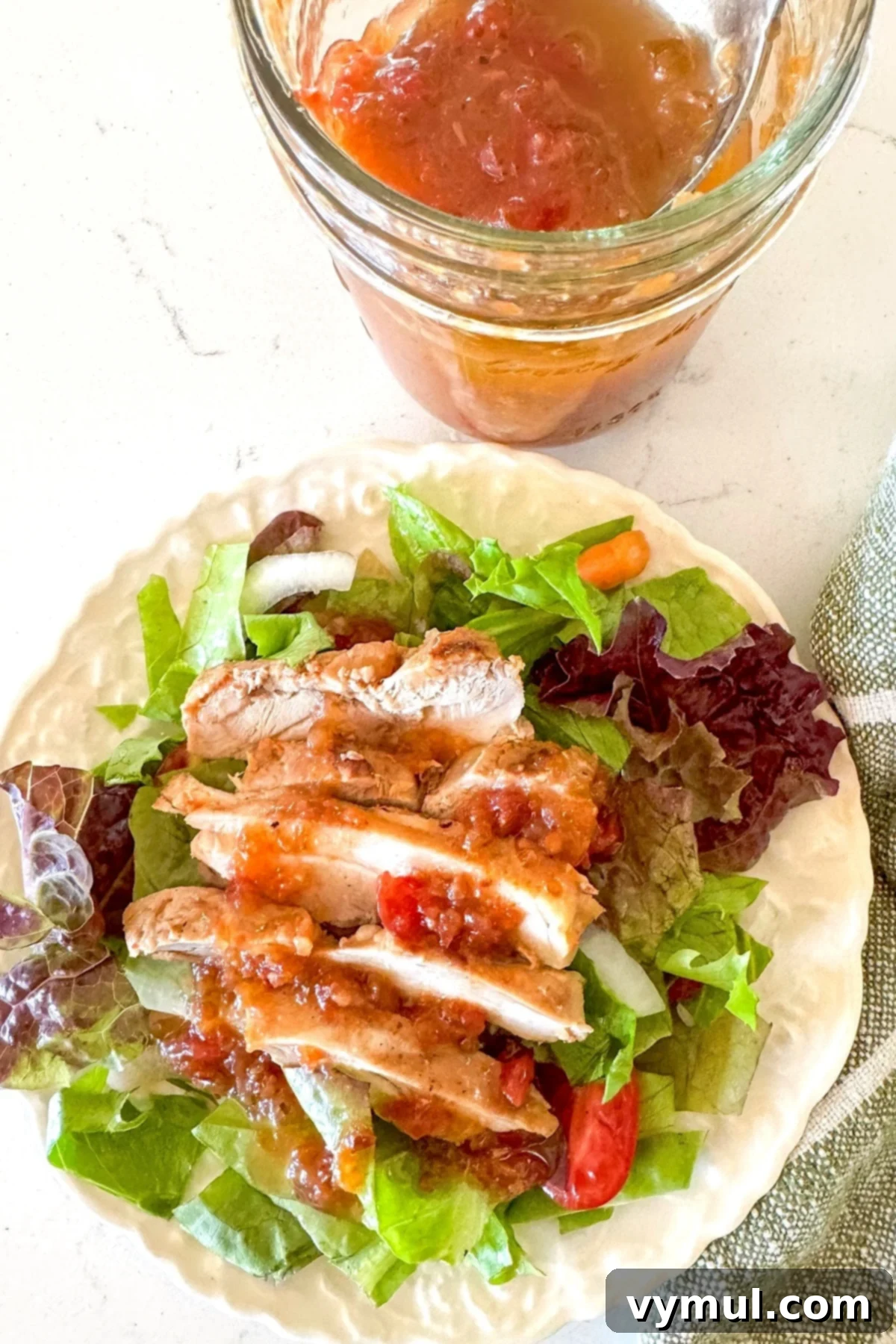 tomato vinaigrette on a chicken breast salad