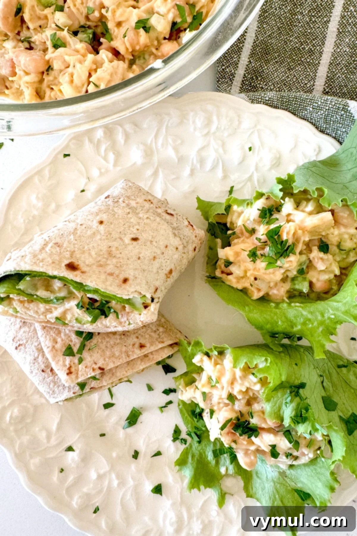 Pantry Powerhouse Protein Chicken Salad 2 Delicious high-protein chicken salad served in vibrant lettuce wraps and whole wheat tortillas for a healthy meal.