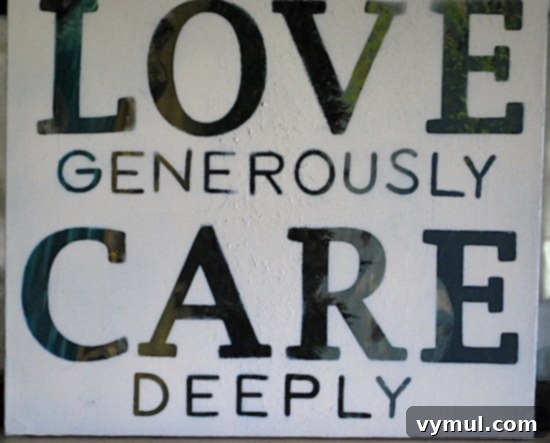 A Breath of Spring Mantel 3 Close-up of DIY canvas art on a mantel displaying 'love' and 'care' with subtle yellow undertones