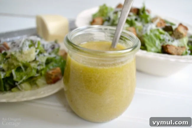 Ditch the Bottle: Fresh & Flavorful Dressings 5 A bowl of fresh Caesar salad generously topped with homemade croutons and a side of creamy Caesar dressing.