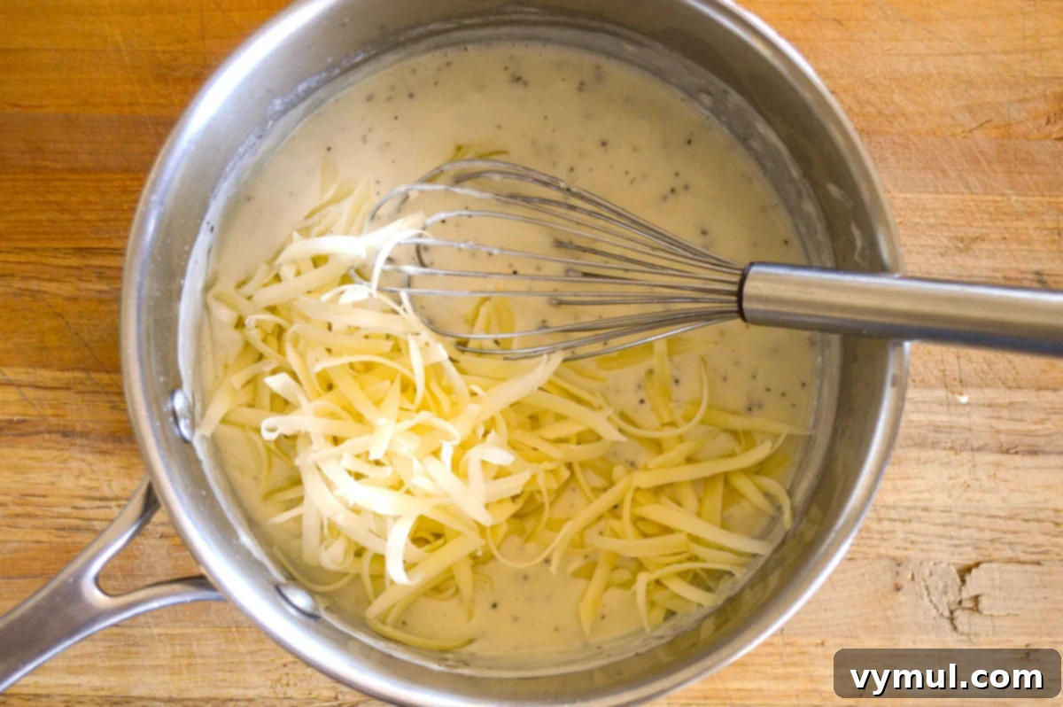 Irresistible Slow Cooker Cheesy Garlic Scalloped Potatoes 4 making sauce for scalloped potatoes