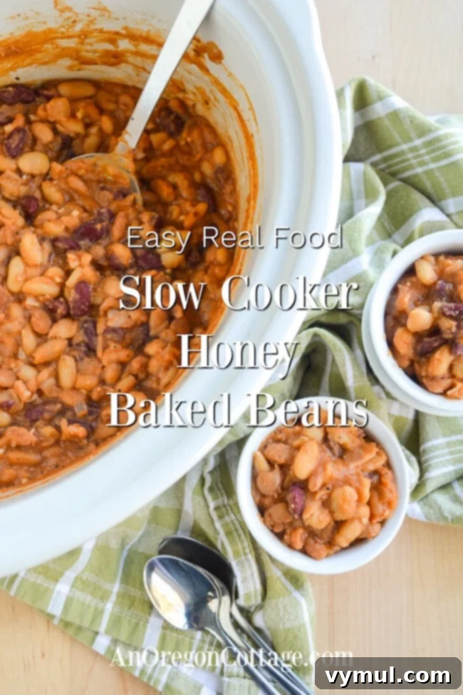 Slow Cooker Honey Baked Beans with Maple Variation 2 Delicious slow cooker baked beans simmering in a pot, ready to be served at a gathering or family meal.