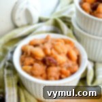 Slow Cooker Honey Baked Beans with Maple Variation 8 Close-up of slow cooker honey baked beans with a rich, glossy sauce, showcasing their wholesome texture.