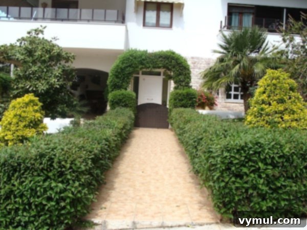 Mediterranean Muses: Greek Gardens 6 hedge-arch front walk