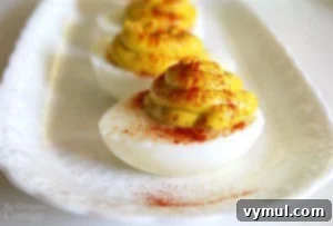 Easy Curried Deviled Eggs on a serving plate.