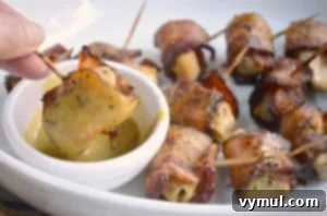 Maple Mustard Bacon Chicken Bites served with a dipping sauce.