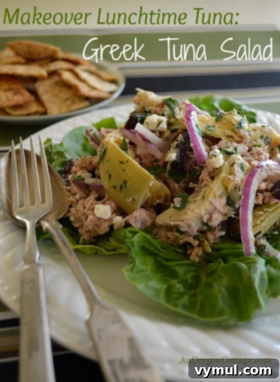 Zesty Greek Tuna Salad with Feta, Olives, and Artichokes 2 Greek Tuna Salad on a bed of lettuce, vibrant and appealing