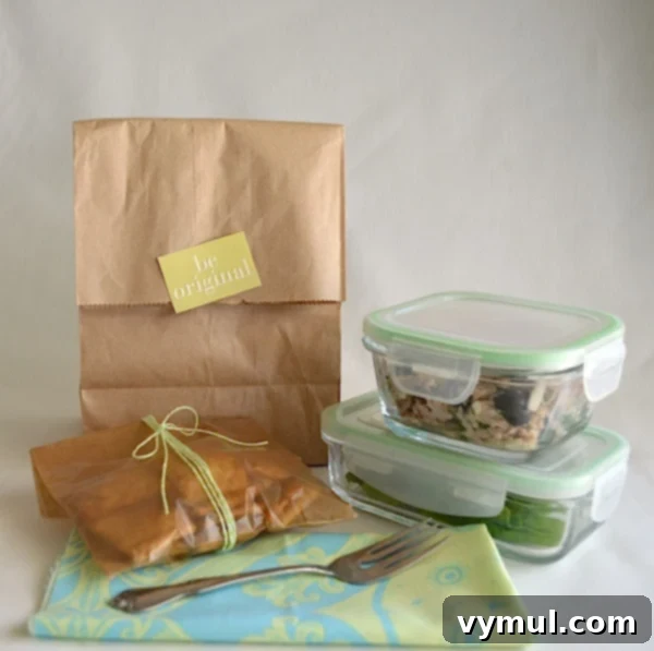 Zesty Greek Tuna Salad with Feta, Olives, and Artichokes 4 Packaged Greek Tuna Salad in a lunchbox with separate lettuce and pita chips