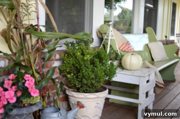 Earthy Elegance: Pink, Green & White Autumn Porch 6 Porch bench throw and flowers - An Oregon Cottage