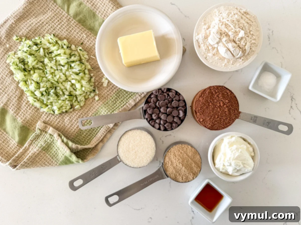 Ingredients for chocolate zucchini cookies laid out on a marble surface