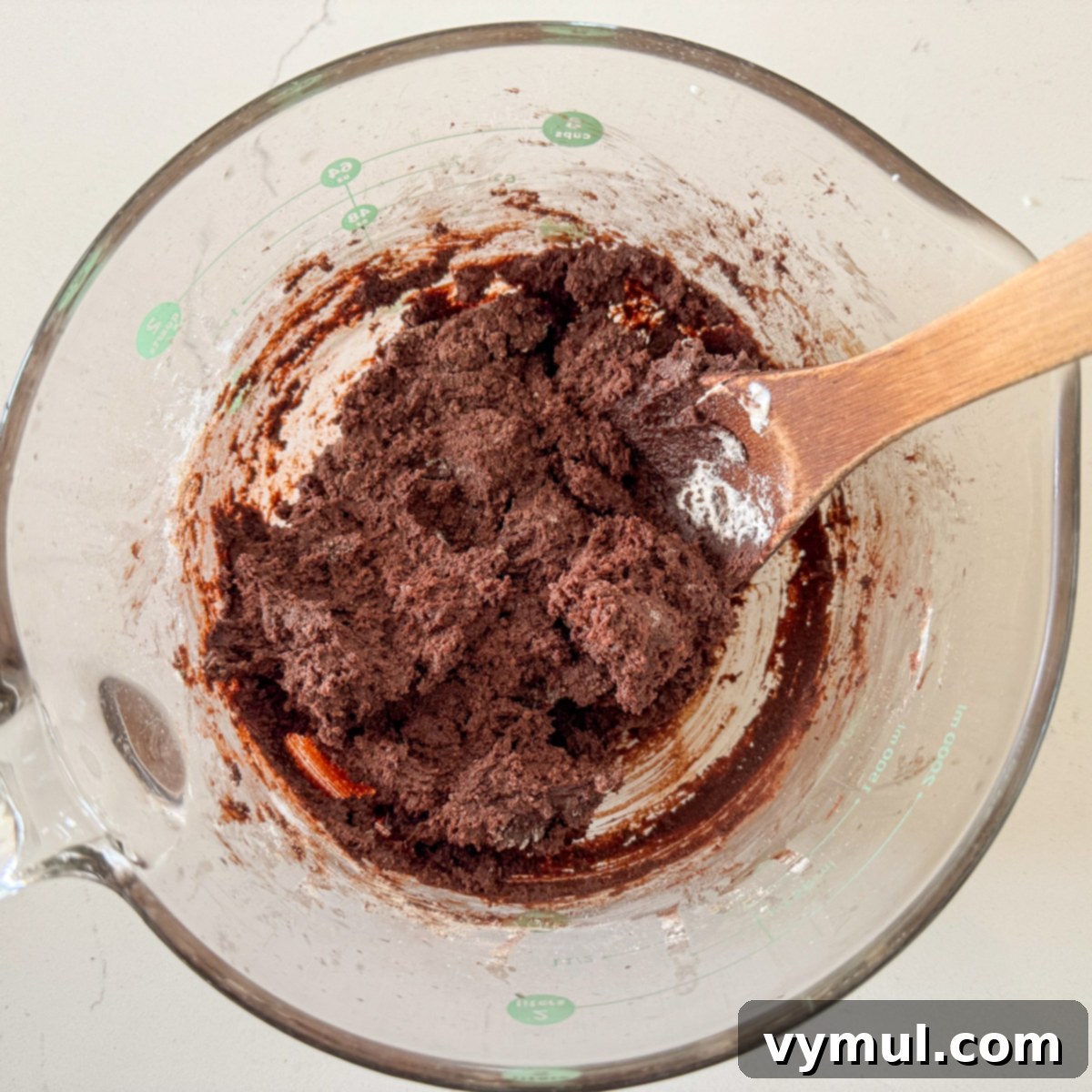 Mixing cookie dough for zucchini cookies in a bowl