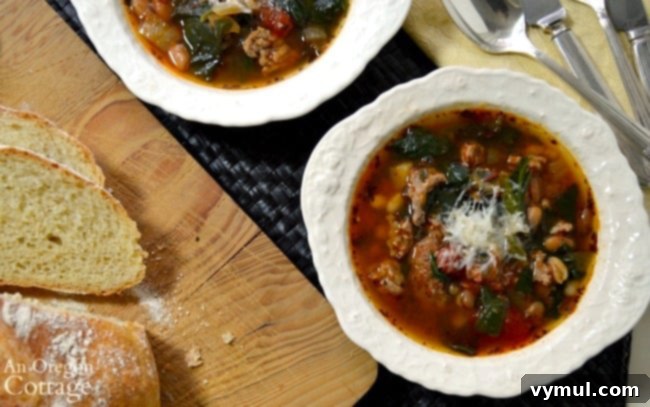 Effortless Sausage, Bean, Spinach, and Tomato Soup (Slow Cooker or Instant Pot) 3 close up of slow cooker sausage bean soup with spinach