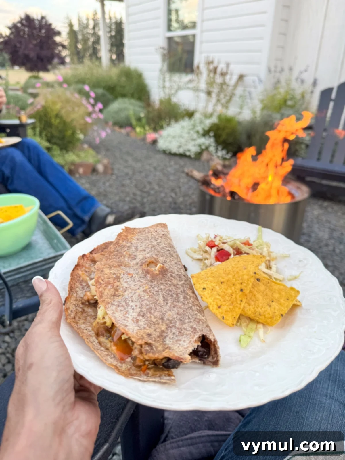 Plate of taco dinner enjoyed around a fire pit on a pleasant October evening