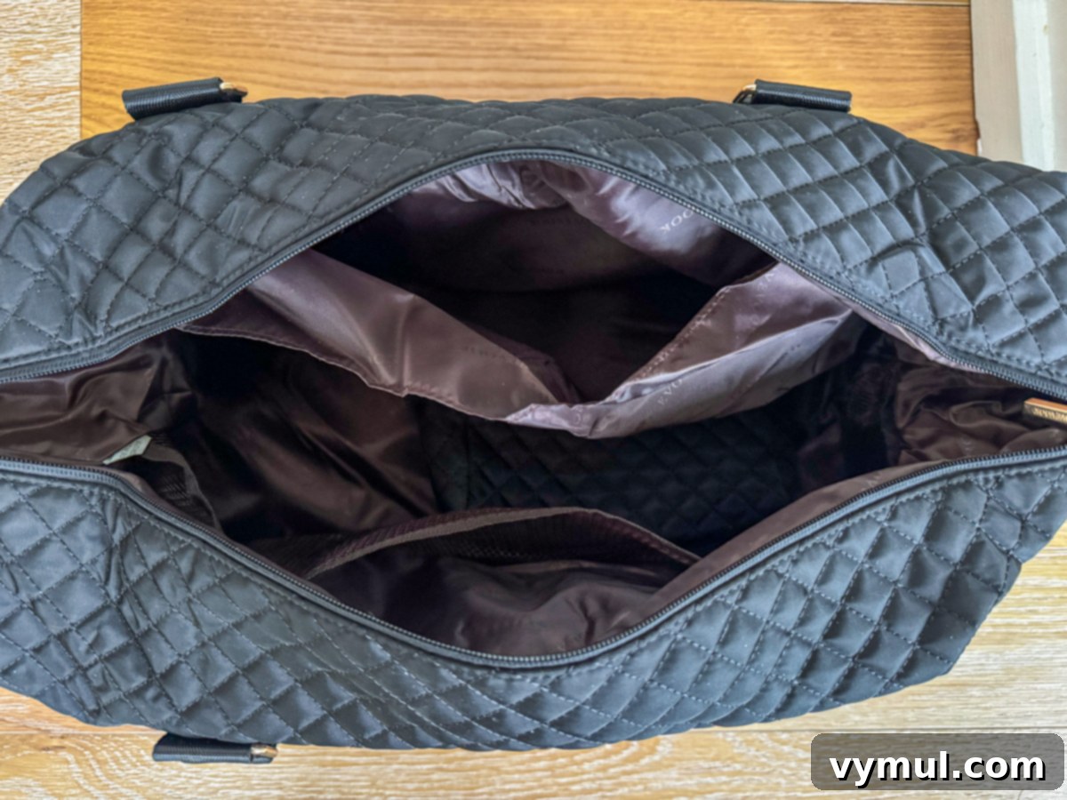 Interior view of the weekender bag, revealing its spacious main compartment and organizational pockets